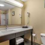 King Suite Bathroom Vanity and Toilet at Quality Inn & Suites Albany
