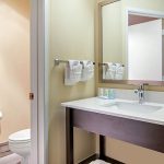 Queen Bed Room's Bathroom Vanity at Quality Inn & Suites Albany